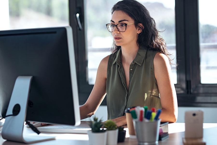 woman working on computer at desk